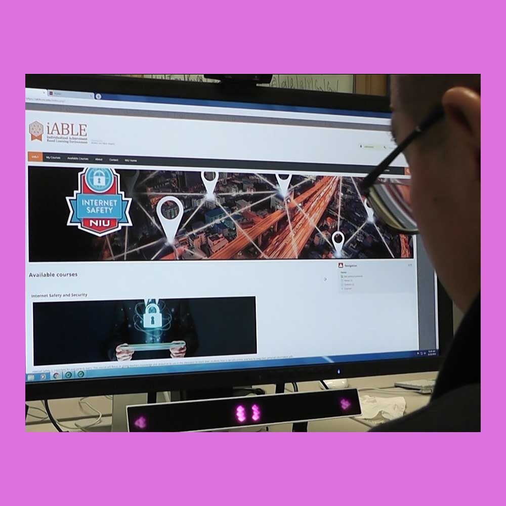 Over-the-should photo of a person testing the iAble web site